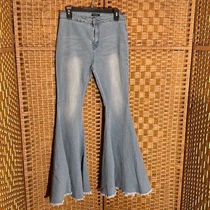 Bell bottom denim jeans that are light in color. They do stretch. Back pockets.